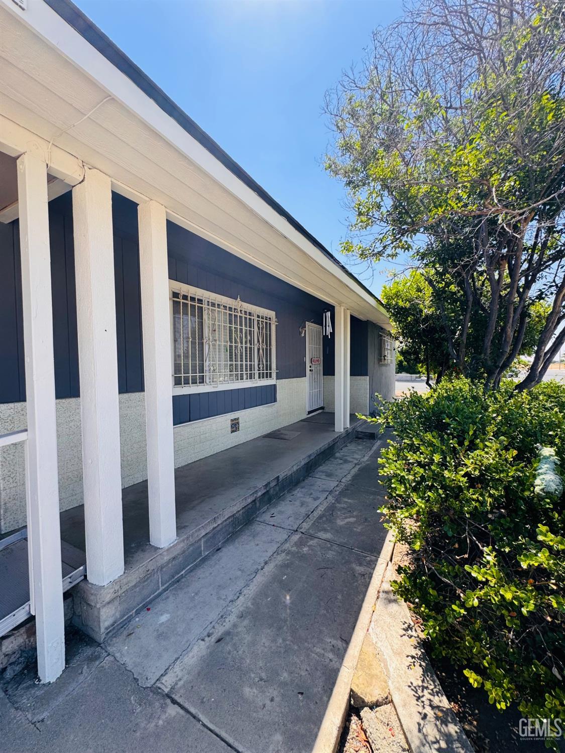 Undisclosed Address Delano, CA 93215 - Photo 5 of 18 a front view of a house with a yard