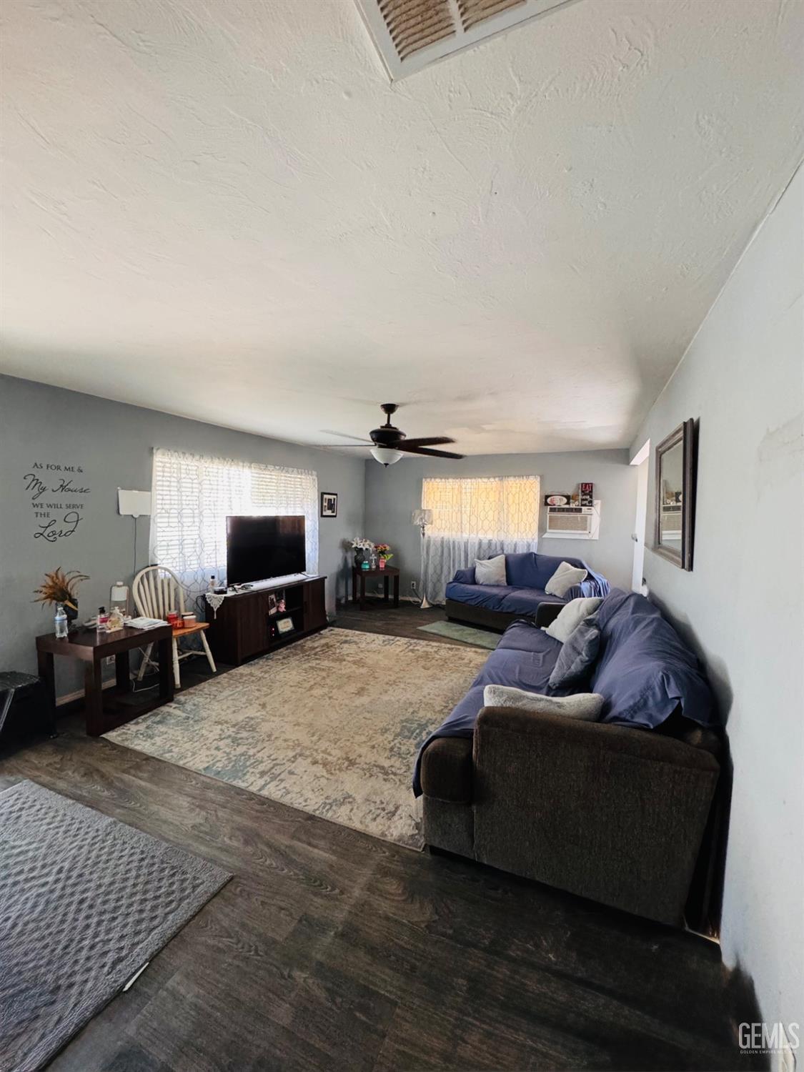 Undisclosed Address Delano, CA 93215 - Photo 6 of 18 a living room with furniture and a window