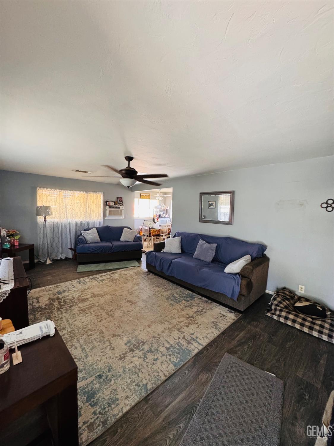 Undisclosed Address Delano, CA 93215 - Photo 7 of 18 a living room with furniture and a flat screen tv