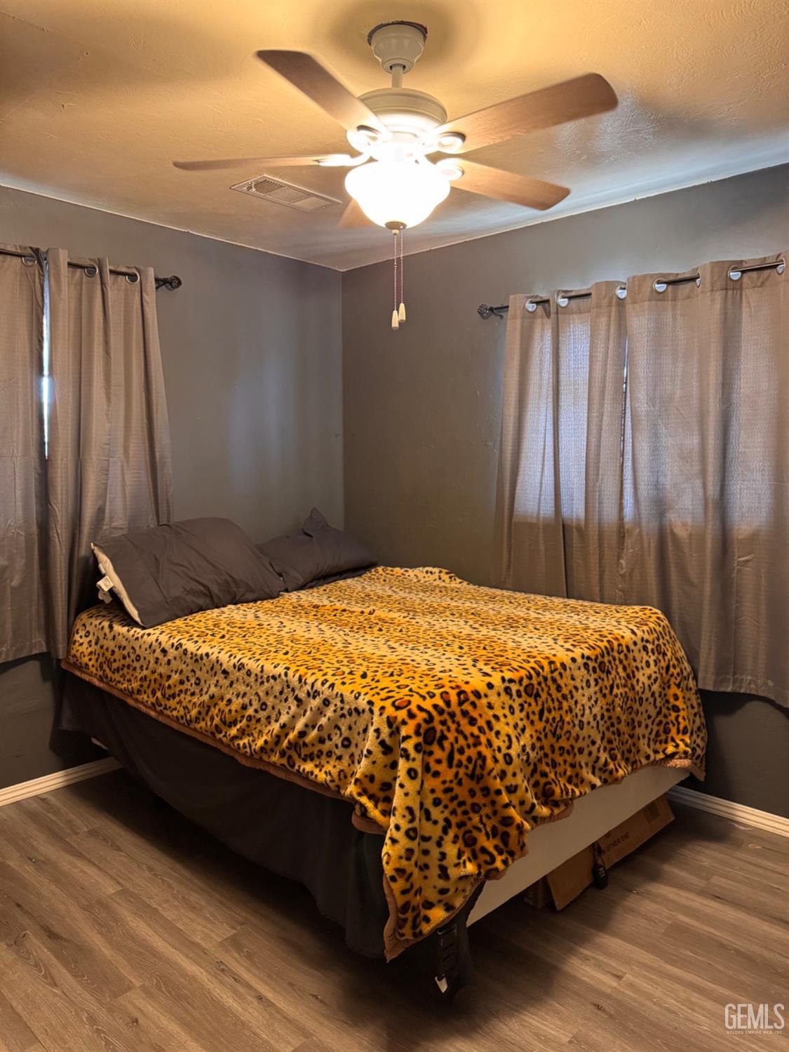 Undisclosed Address Delano, CA 93215 - Photo 8 of 18 a bed sitting in a bedroom next to a window