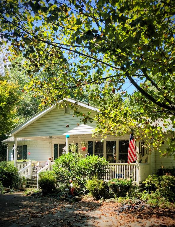 1497 Harris Road Jasper, GA 30143 - Photo 1 of 32 a front view of a house with a yard
