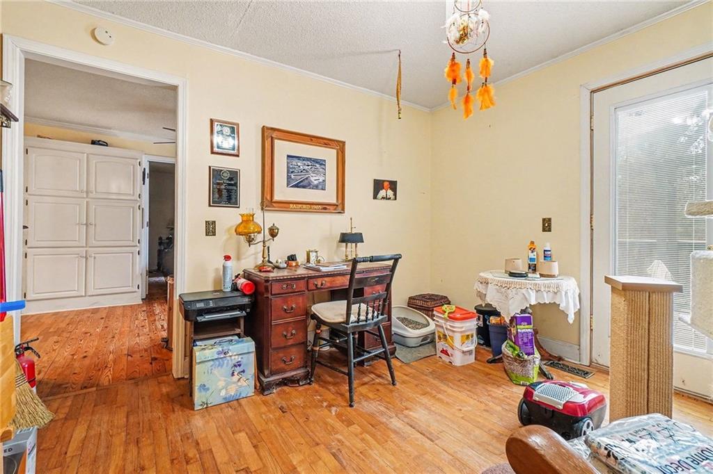 1497 Harris Road Jasper, GA 30143 - Photo 11 of 32 a living room with furniture and wooden floor