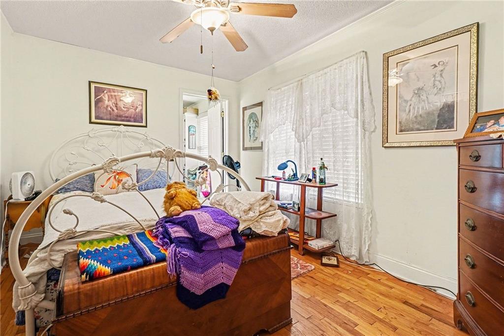 1497 Harris Road Jasper, GA 30143 - Photo 13 of 32 a bedroom with furniture and a wooden floor