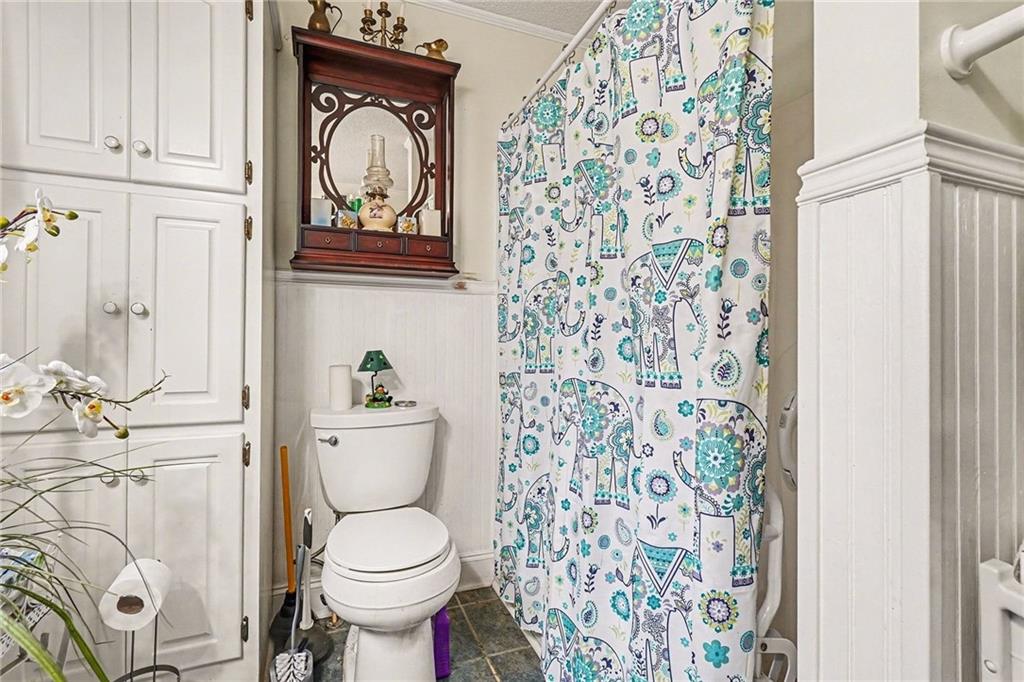 1497 Harris Road Jasper, GA 30143 - Photo 15 of 32 a white toilet sitting next to a bathroom sink