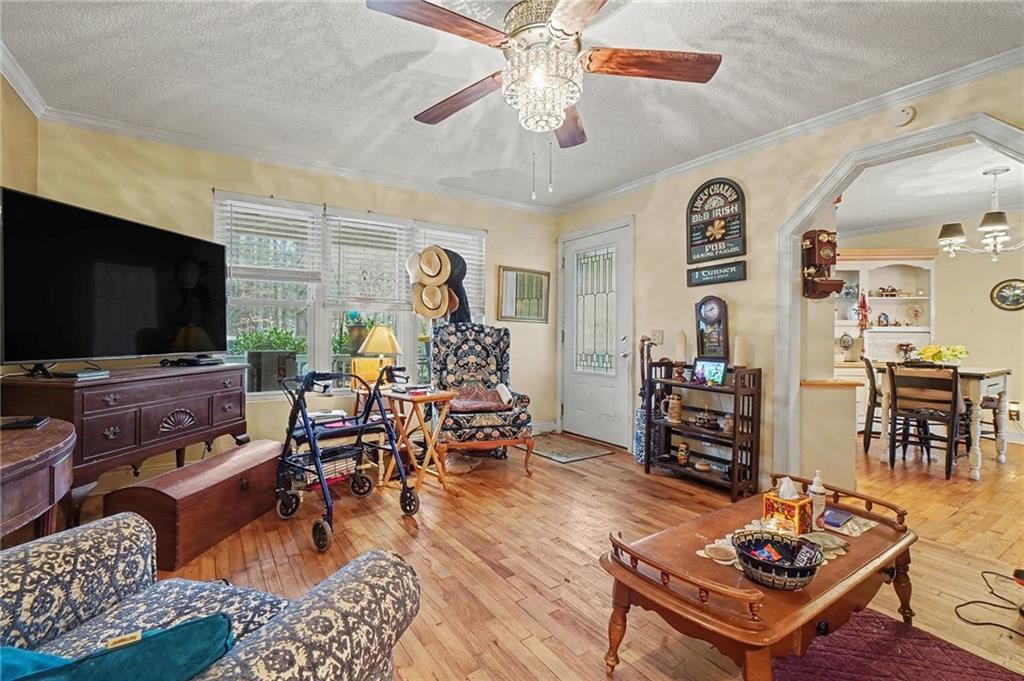 1497 Harris Road Jasper, GA 30143 - Photo 3 of 32 a living room with furniture and a flat screen tv