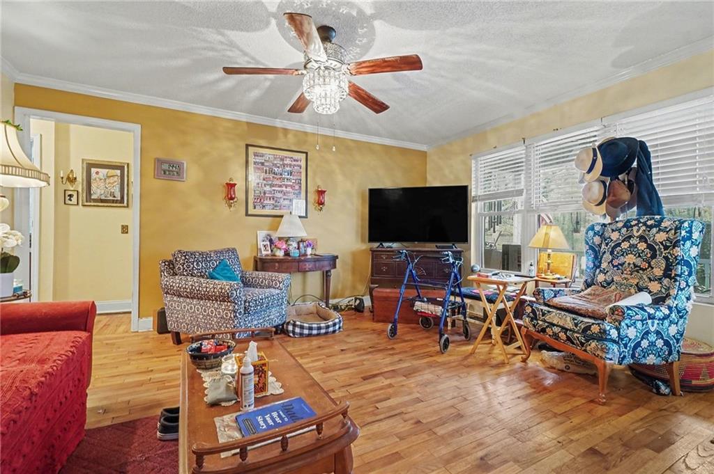 1497 Harris Road Jasper, GA 30143 - Photo 7 of 32 a living room with furniture and a flat screen tv