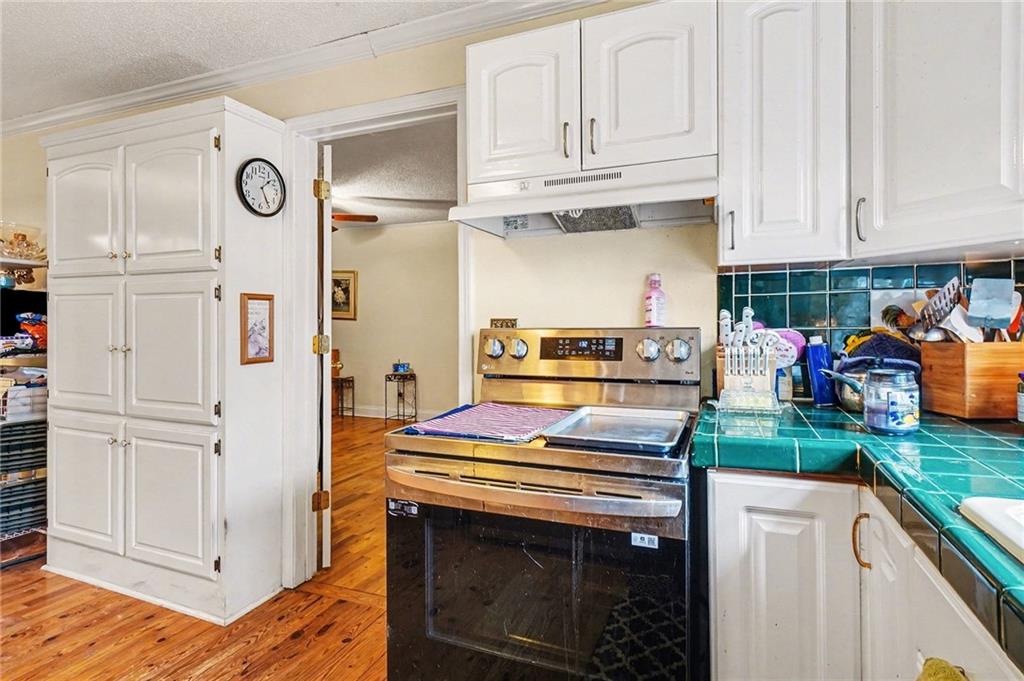 1497 Harris Road Jasper, GA 30143 - Photo 10 of 32 a kitchen with stainless steel appliances granite countertop a stove and a refrigerator
