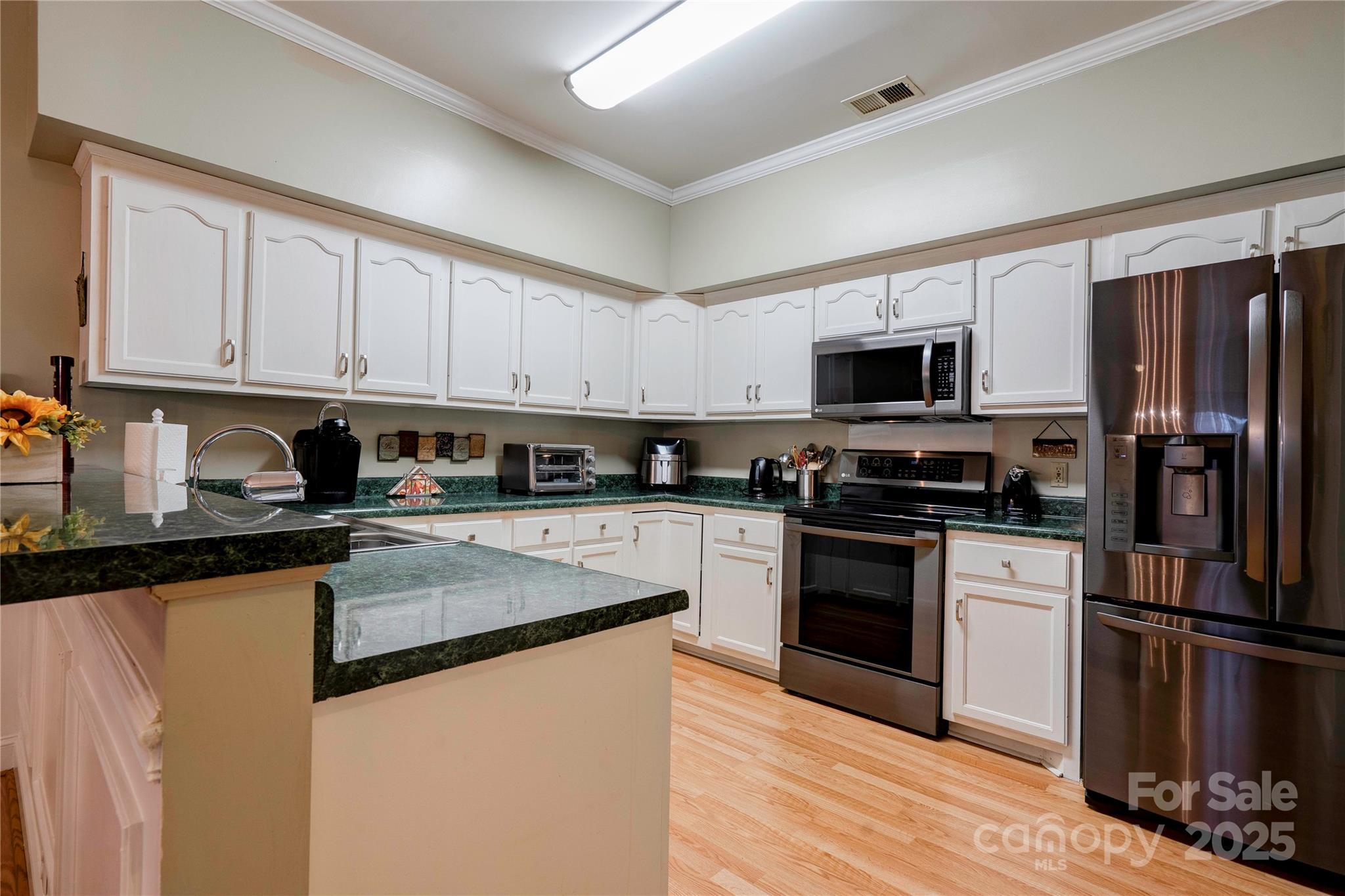 150 Columns Circle Shelby, NC 28150 - Photo 11 of 44 a kitchen with granite countertop a refrigerator stove and microwave