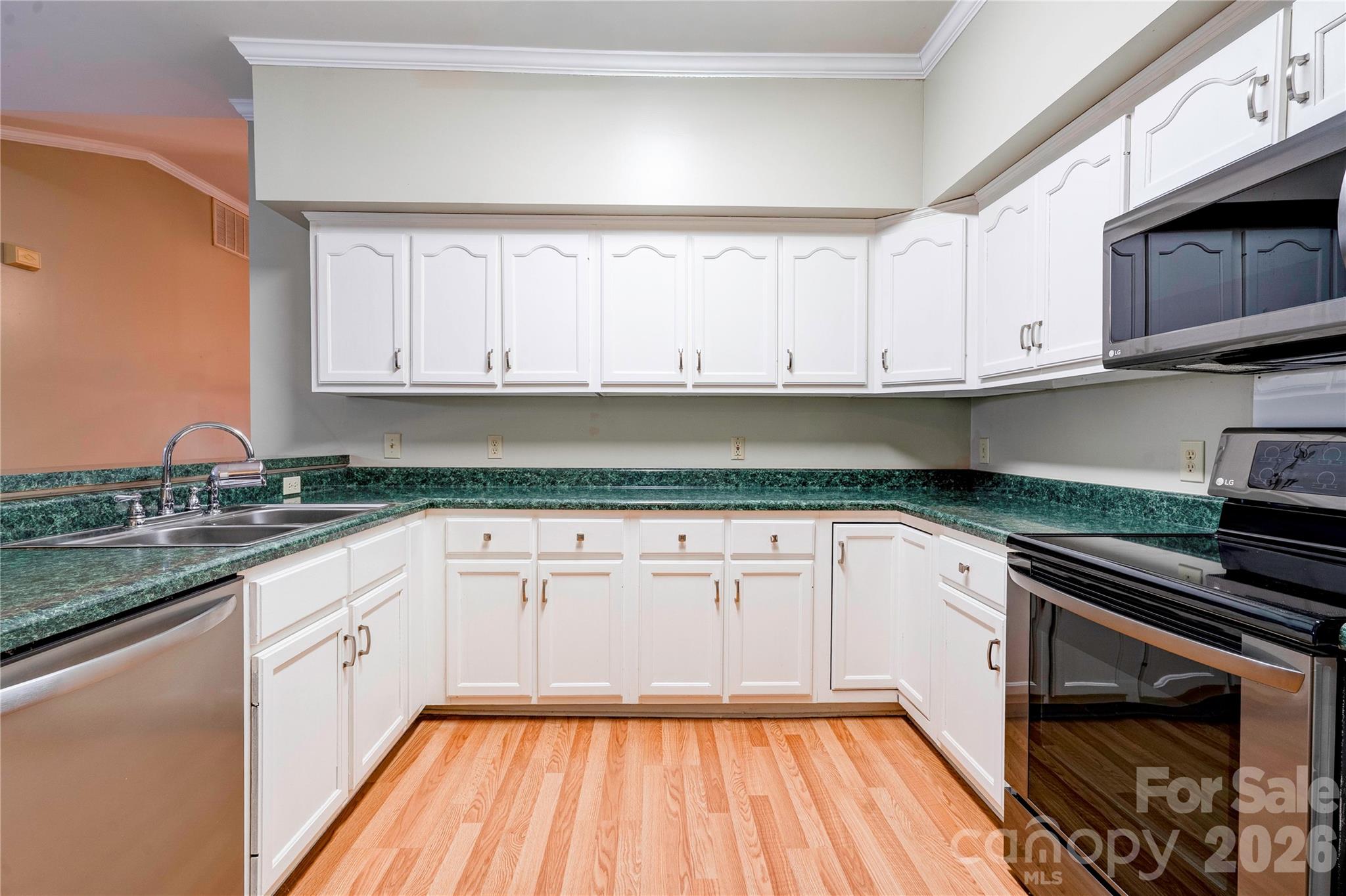 150 Columns Circle Shelby, NC 28150 - Photo 11 of 42 a kitchen with granite countertop white cabinets and white appliances
