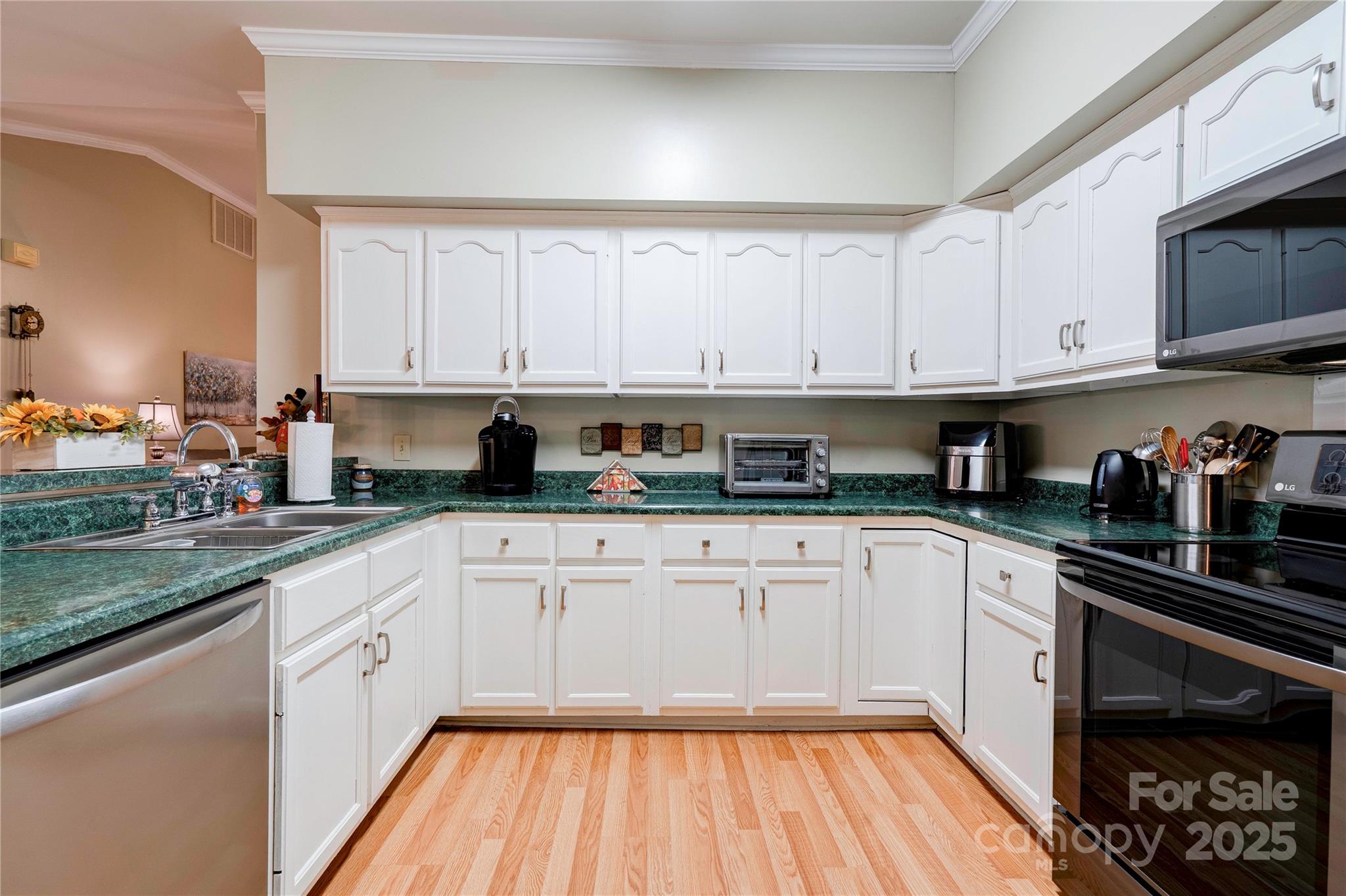 150 Columns Circle Shelby, NC 28150 - Photo 12 of 44 a kitchen with stainless steel appliances granite countertop a stove a sink and white cabinets