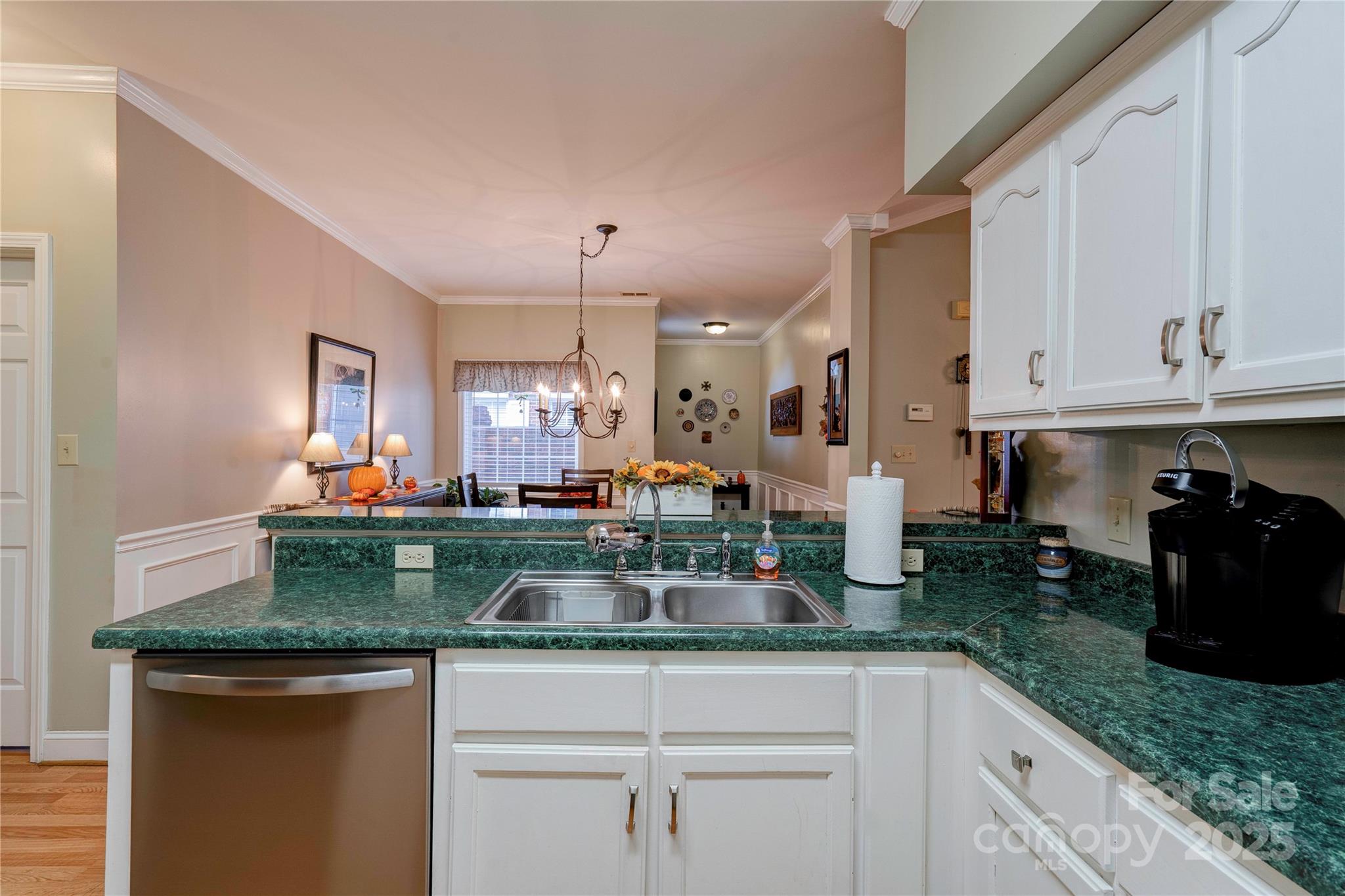 150 Columns Circle Shelby, NC 28150 - Photo 13 of 44 a kitchen with granite countertop a sink stainless steel appliances and white cabinets