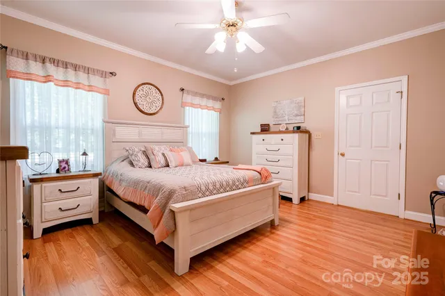 a spacious bedroom with a bed and a window