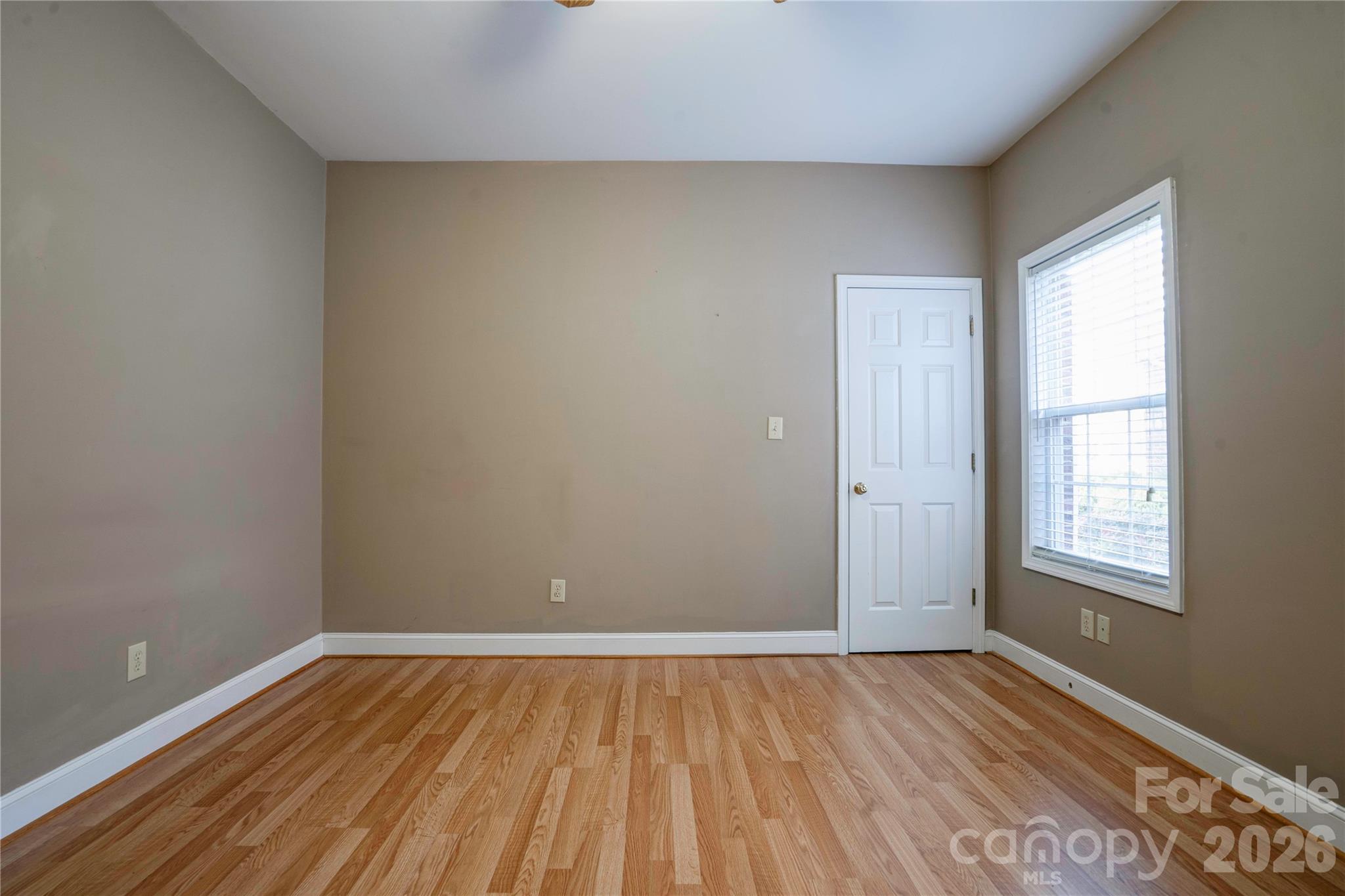 150 Columns Circle Shelby, NC 28150 - Photo 28 of 42 an empty room with wooden floor and windows