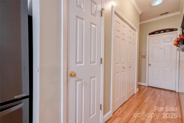 a view of hallway with wooden floor