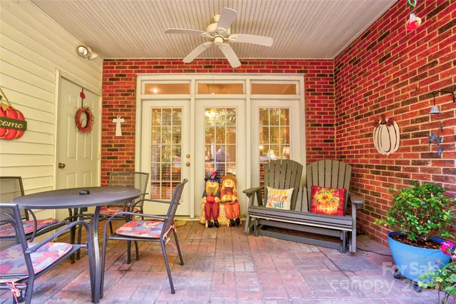 a view of a backyard with sitting area