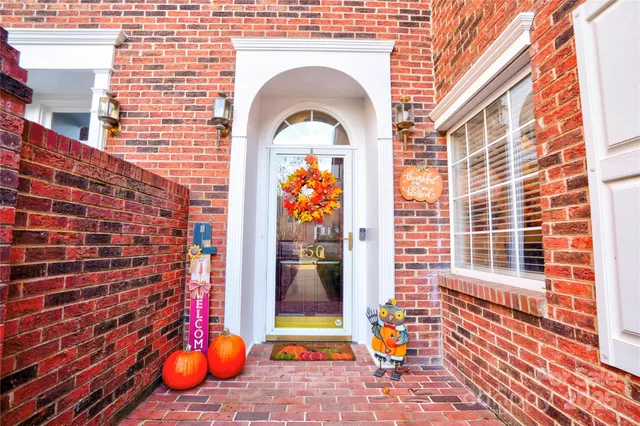 a view of a brick wall with windows