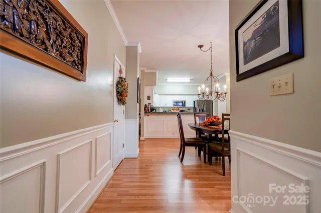 a dining room with furniture and wooden floor