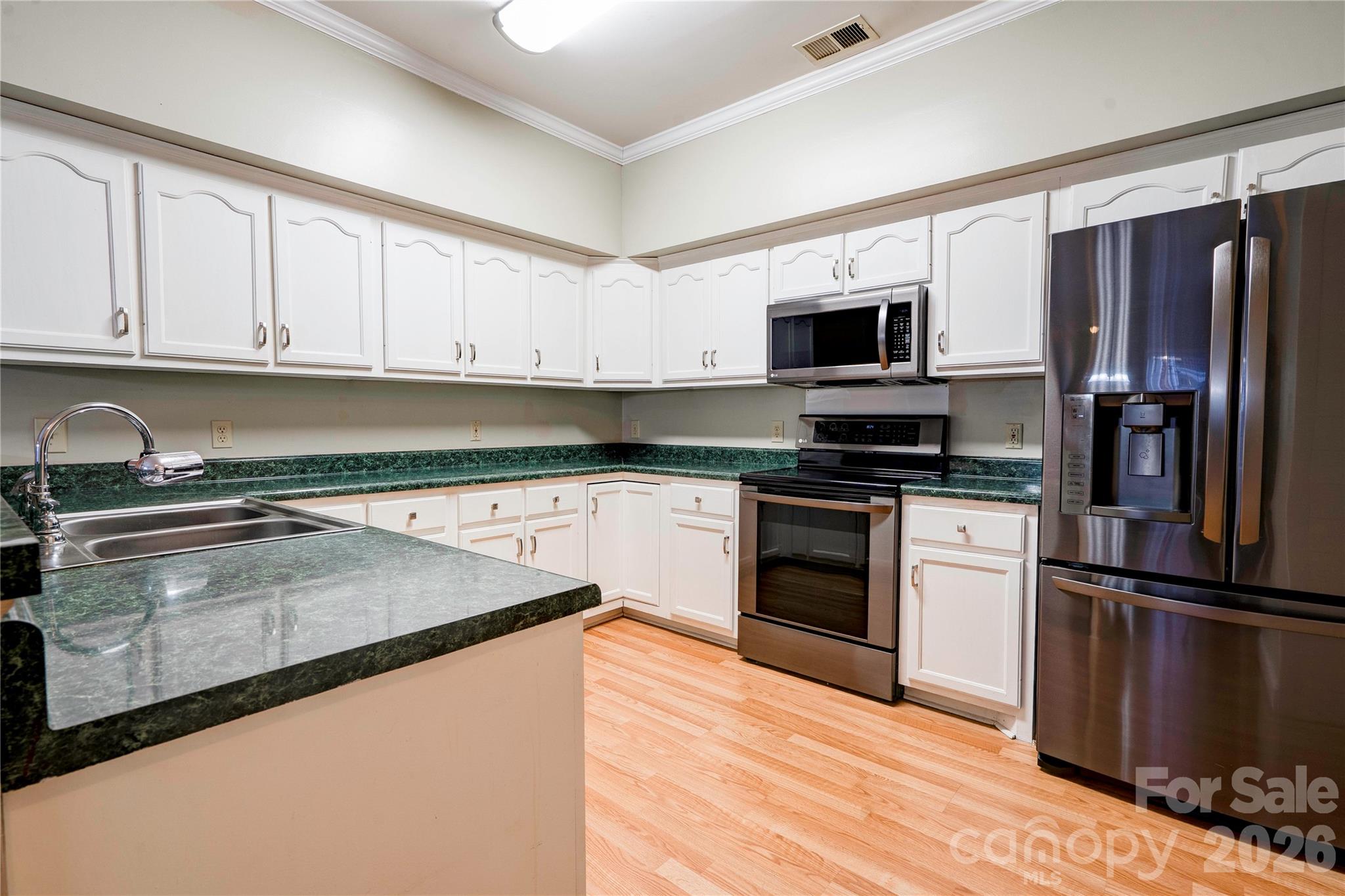 150 Columns Circle Shelby, NC 28150 - Photo 10 of 42 a kitchen with granite countertop a refrigerator stove top oven and sink