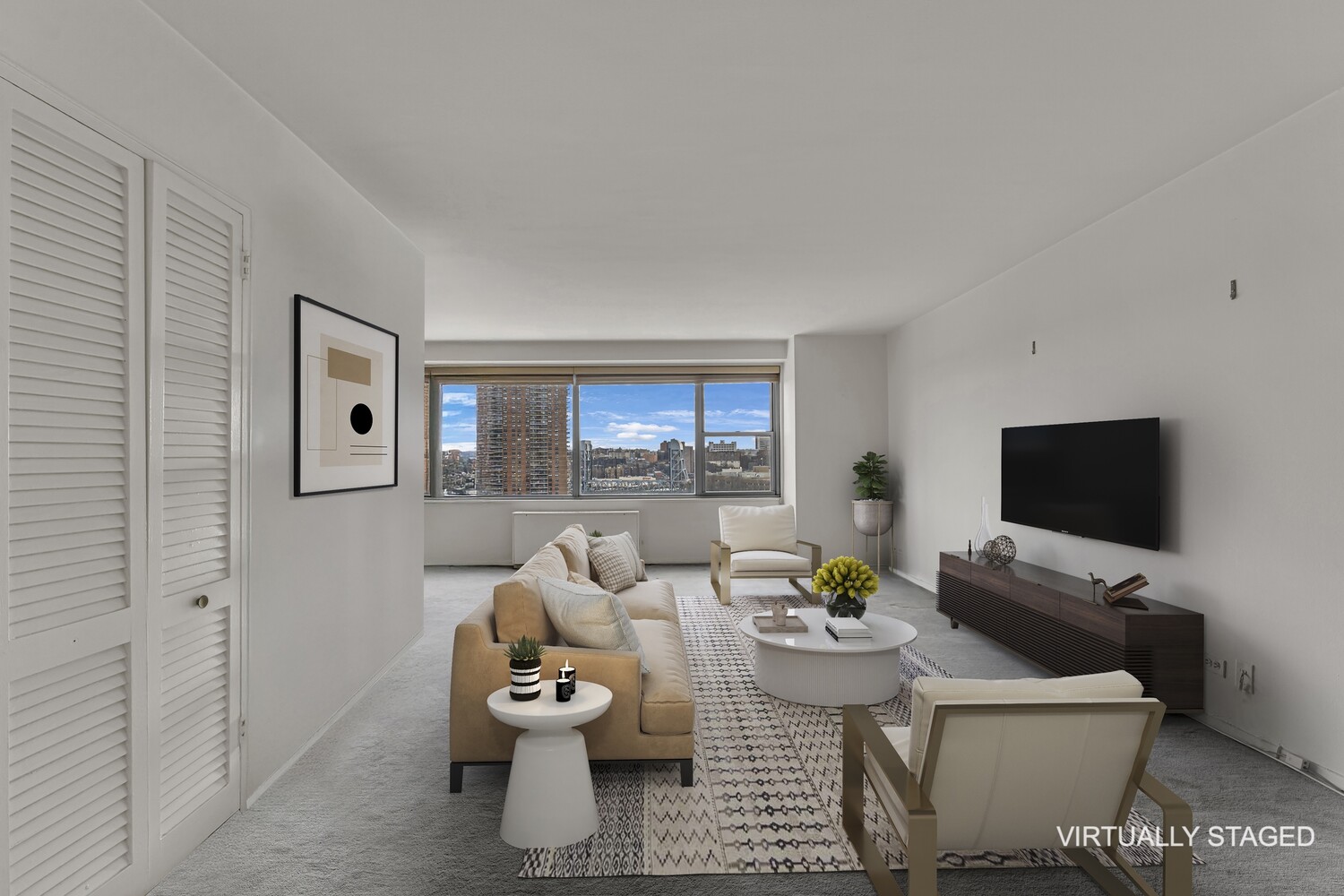 2500 Johnson Avenue, Unit 6T Bronx, NY 10463 - Photo 1 of 8 a living room with furniture and a flat screen tv