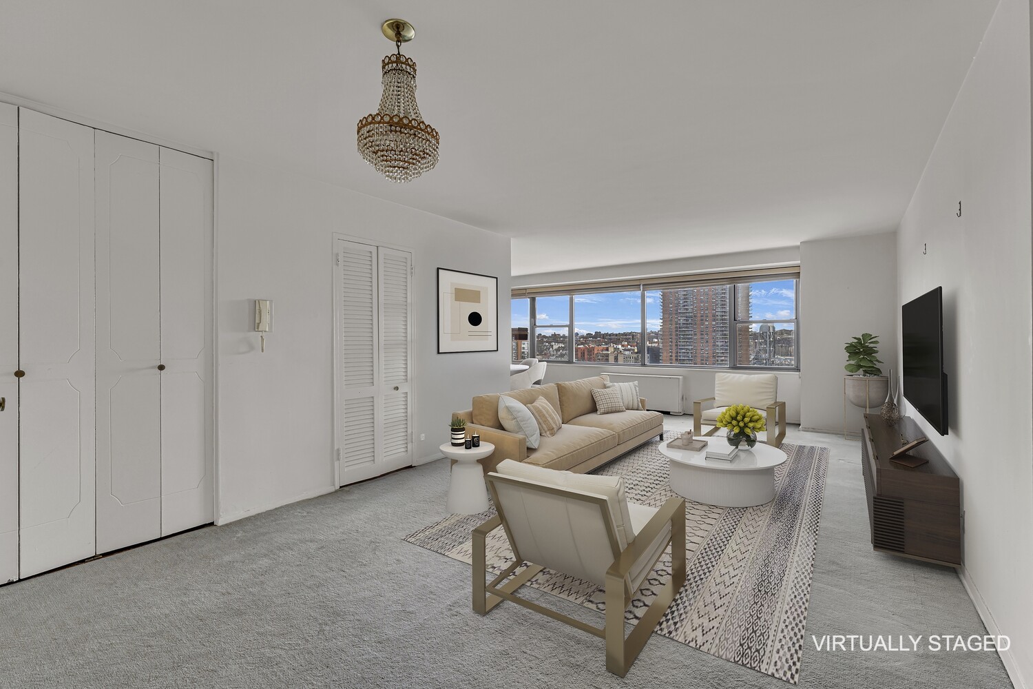 2500 Johnson Avenue, Unit 6T Bronx, NY 10463 - Photo 2 of 8 a living room with furniture a window and a flat screen tv