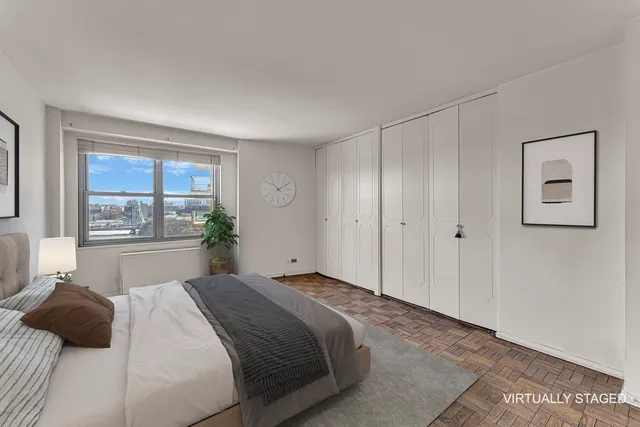 a bedroom with a bed and a window