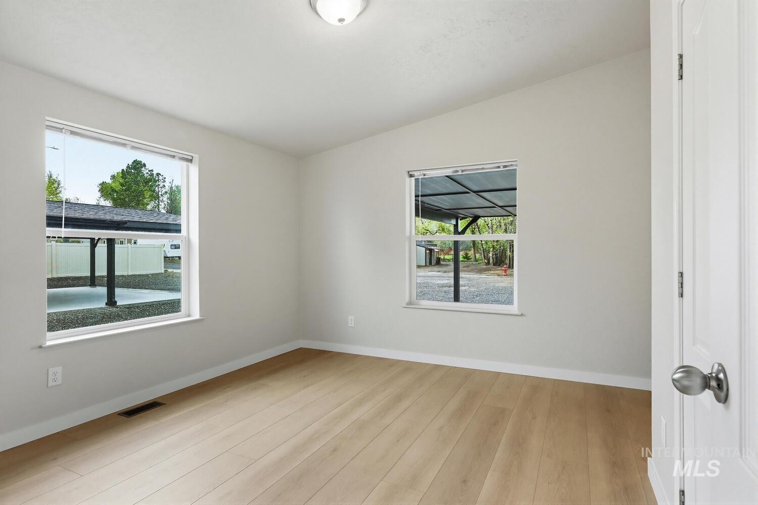 166 1st Street North Marsing, ID 83639 - Photo 15 of 37 Spare room featuring light wood-type flooring and baseboards