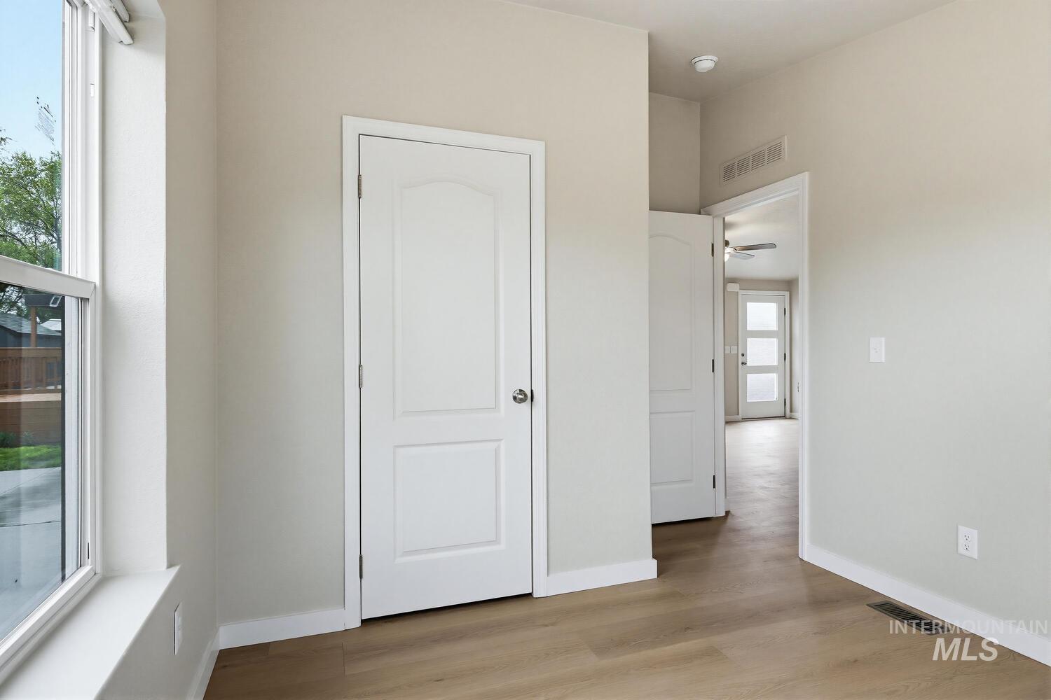 166 1st Street North Marsing, ID 83639 - Photo 21 of 37 Unfurnished bedroom with light wood-style floors and baseboards