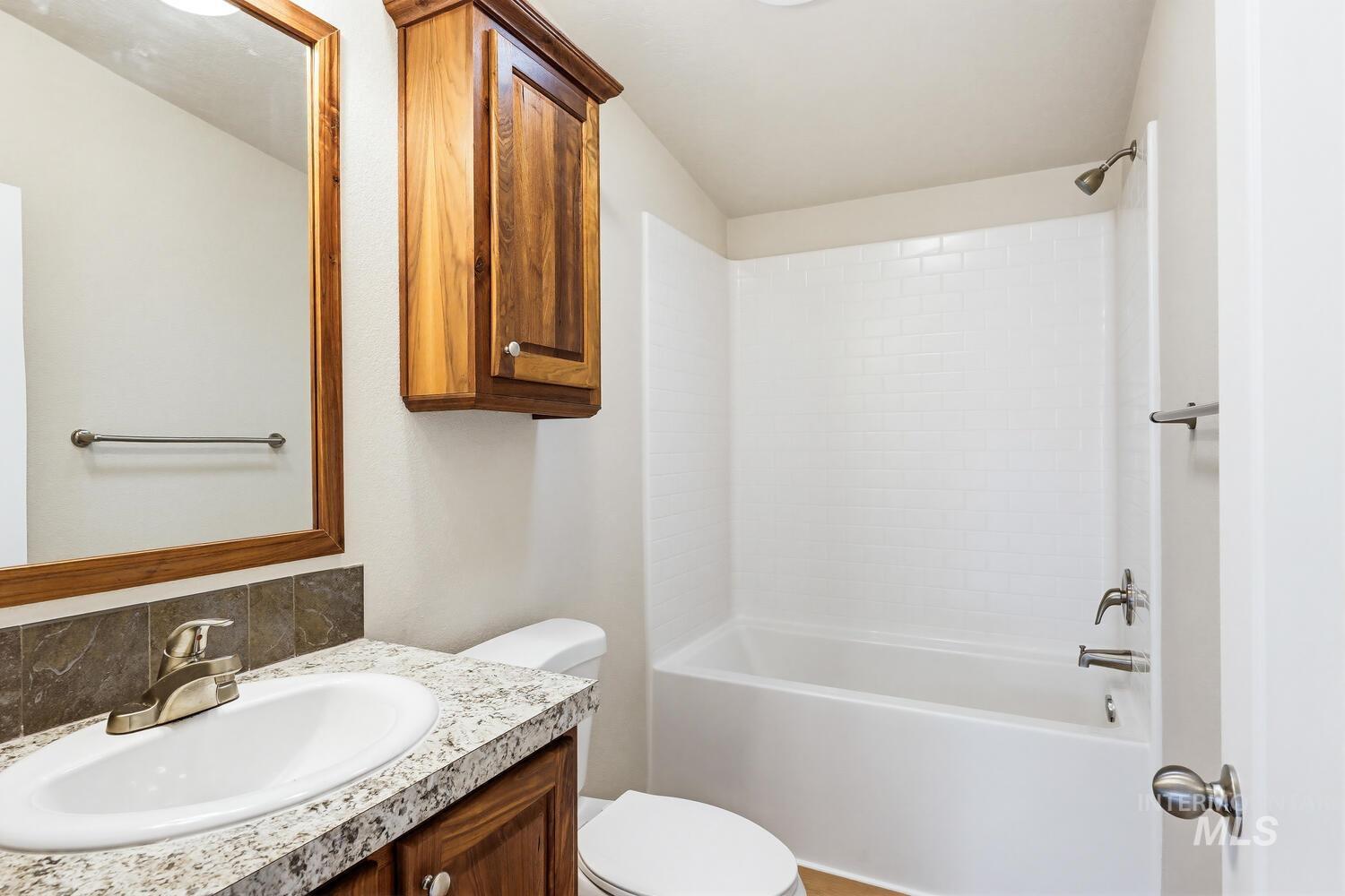 166 1st Street North Marsing, ID 83639 - Photo 22 of 37 Bathroom with vanity, shower / tub combination, and backsplash
