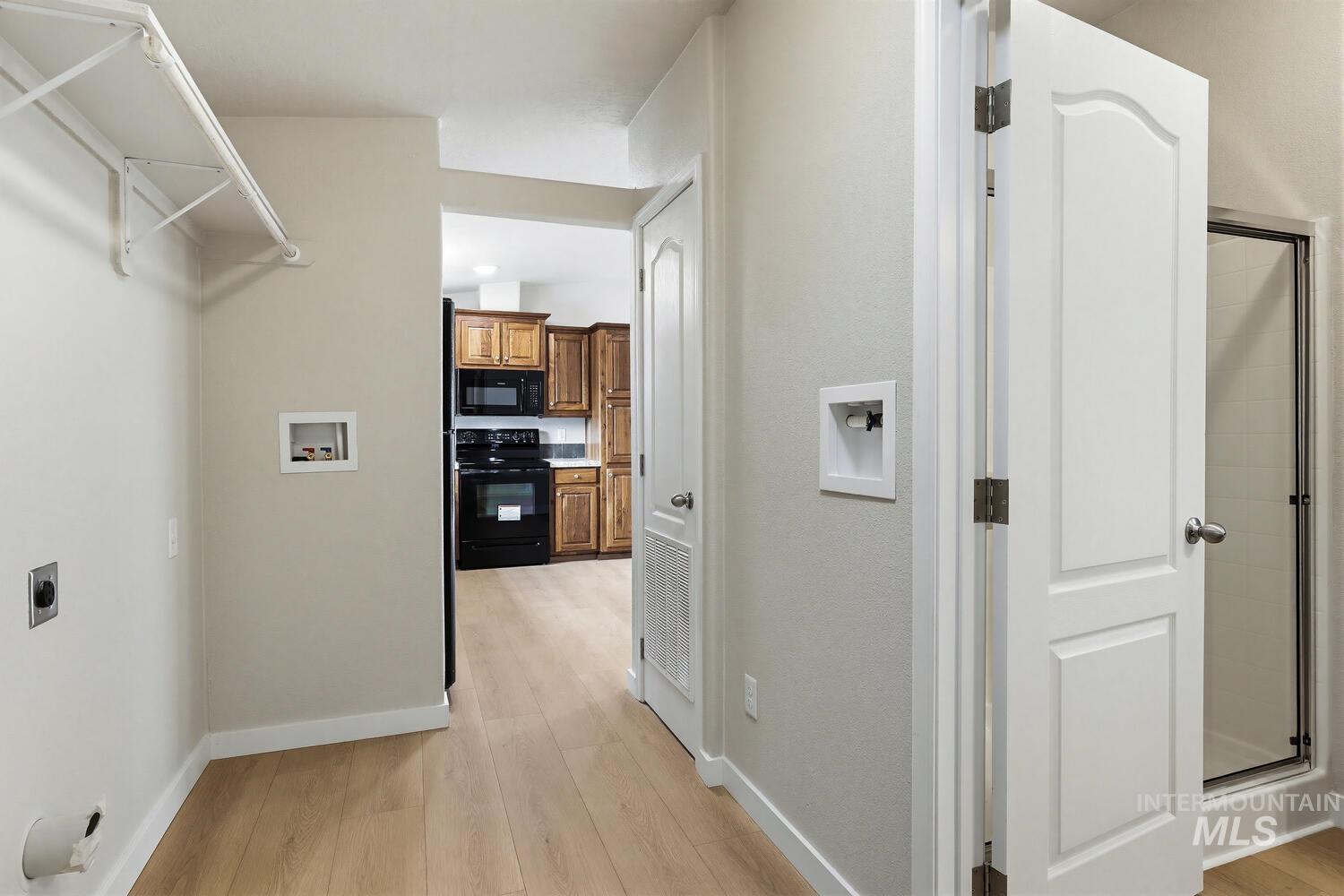 166 1st Street North Marsing, ID 83639 - Photo 26 of 37 Hallway with light wood-style floors and baseboards
