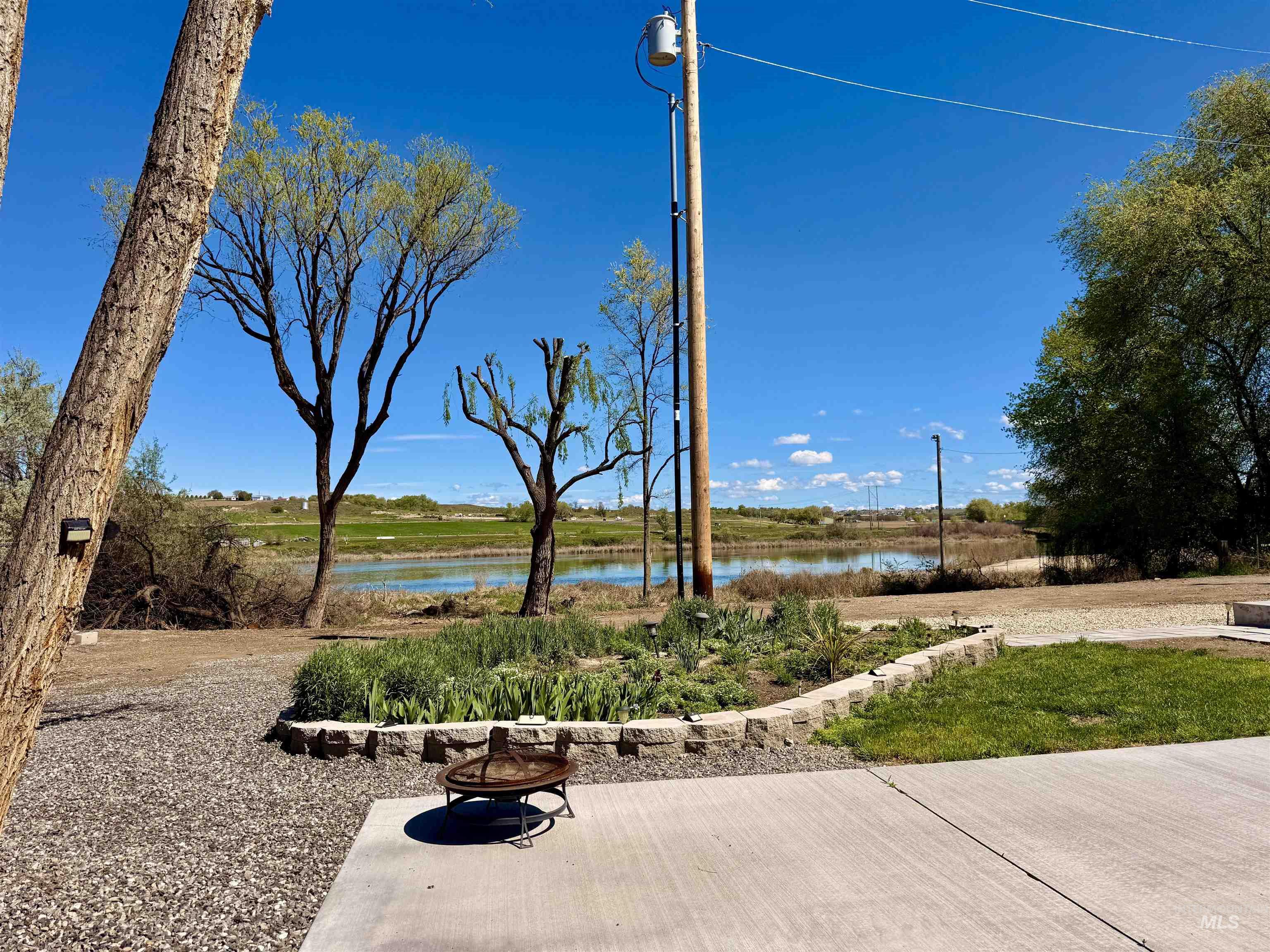 166 1st Street North Marsing, ID 83639 - Photo 27 of 37 View of patio with an outdoor fire pit and a water view