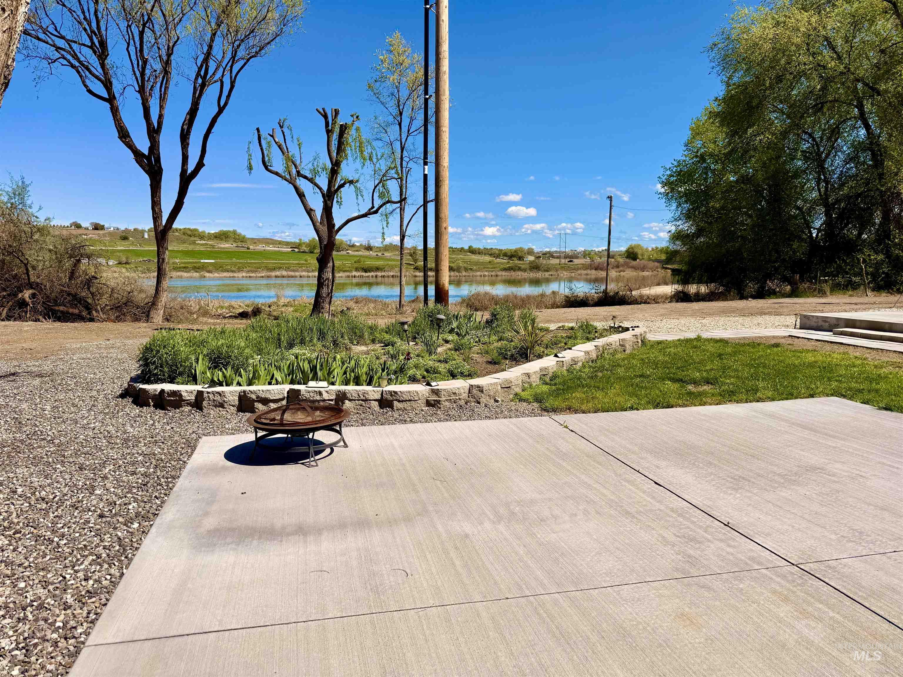 166 1st Street North Marsing, ID 83639 - Photo 29 of 37 View of patio featuring an outdoor fire pit and a water view
