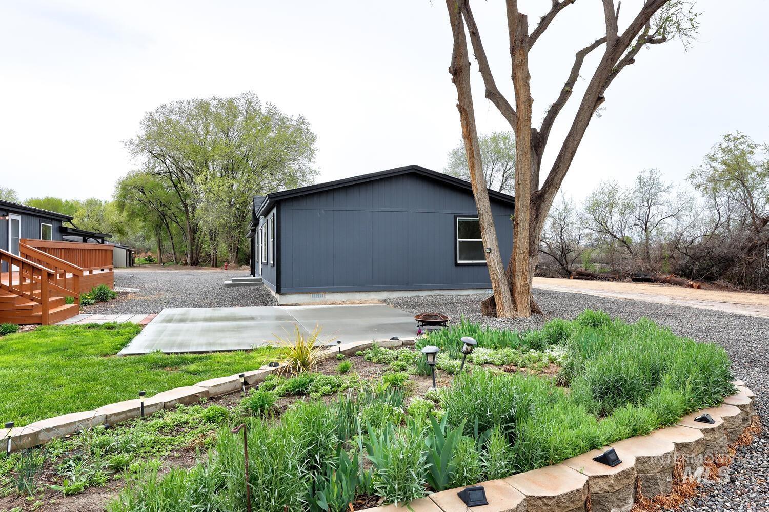 166 1st Street North Marsing, ID 83639 - Photo 30 of 37 View of side of property with a deck