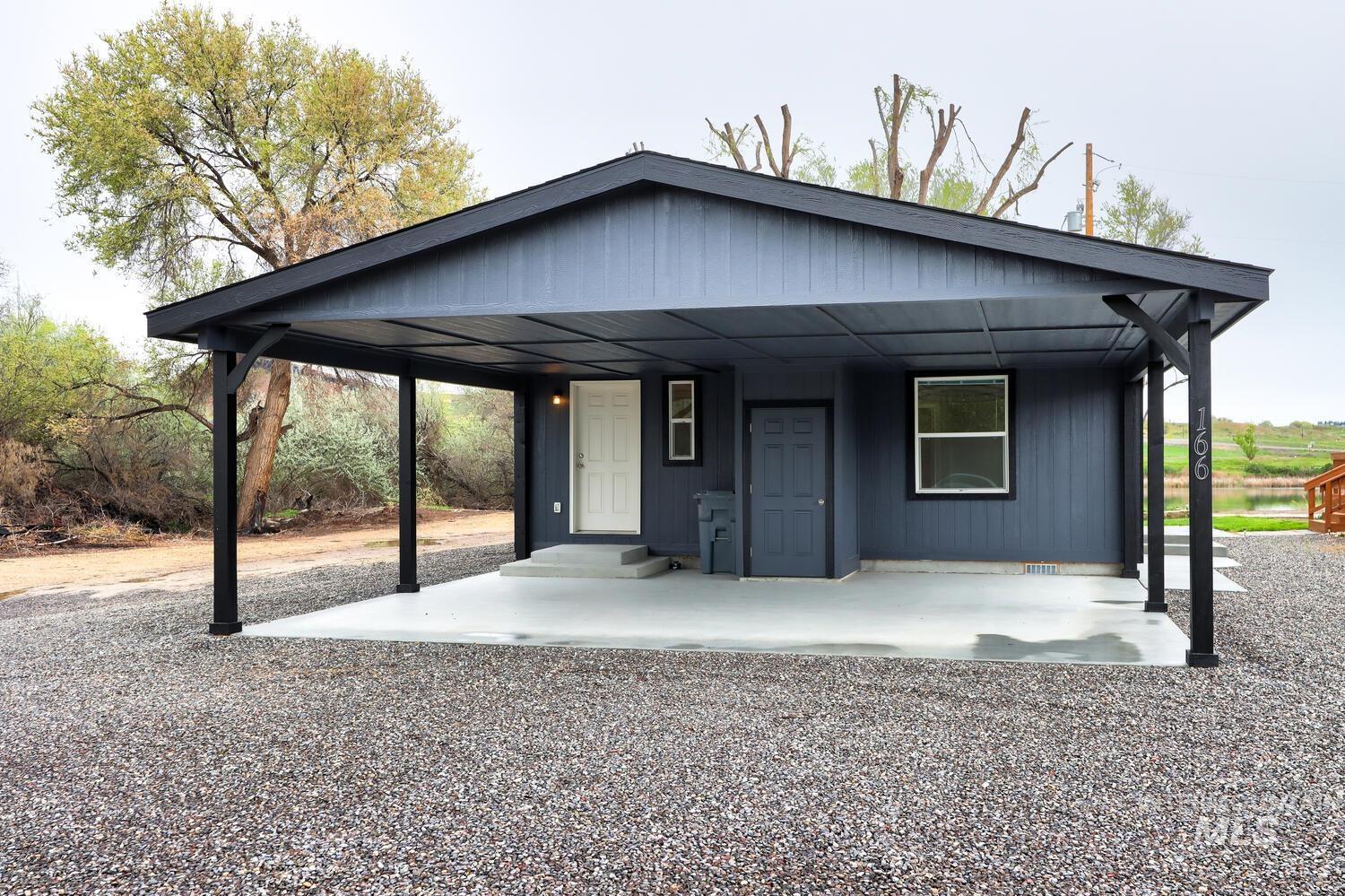 166 1st Street North Marsing, ID 83639 - Photo 32 of 37 View of front of house with a porch and a carport
