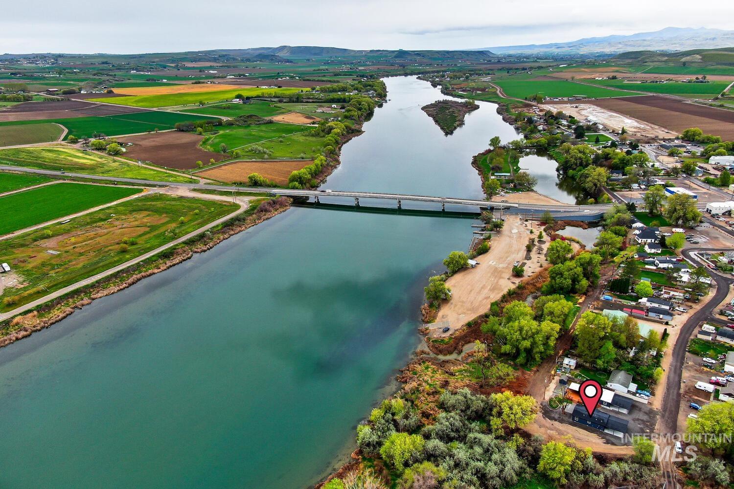 166 1st Street North Marsing, ID 83639 - Photo 37 of 37 Aerial view of sparsely populated area with a large body of water and abundant farmland