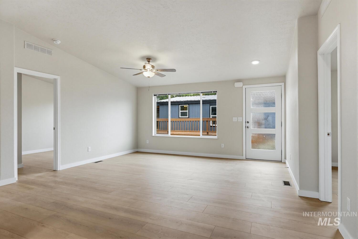 166 1st Street North Marsing, ID 83639 - Photo 5 of 37 Empty room with ceiling fan, light wood-style flooring, and recessed lighting
