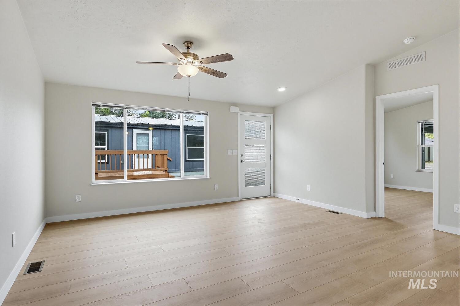 166 1st Street North Marsing, ID 83639 - Photo 6 of 37 Spare room featuring ceiling fan, light wood-type flooring, and recessed lighting