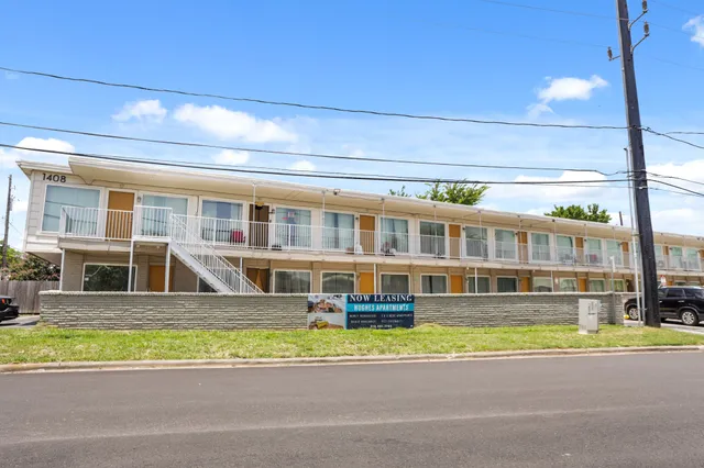 a view of an apartment with a swimming pool
