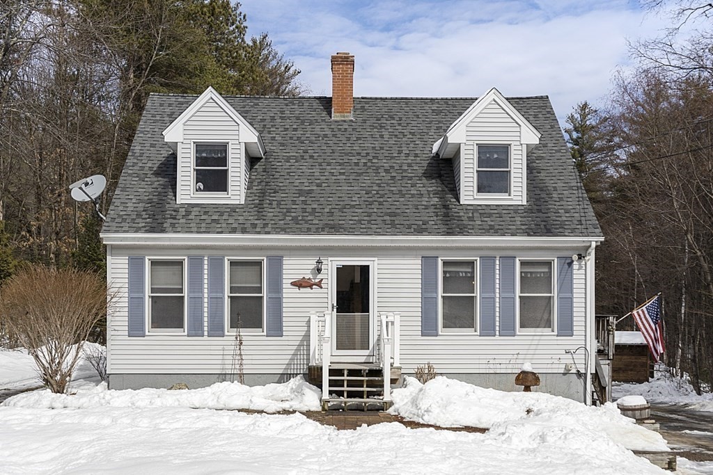 864 Foster Road Ashby, MA 01431 - Photo 1 of 41 a front view of a house with a yard
