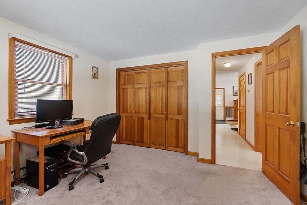 864 Foster Road Ashby, MA 01431 - Photo 17 of 41 a view of a workspace with furniture and a window