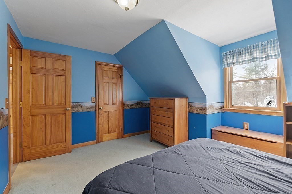 864 Foster Road Ashby, MA 01431 - Photo 26 of 41 a bedroom with a bed and a dresser