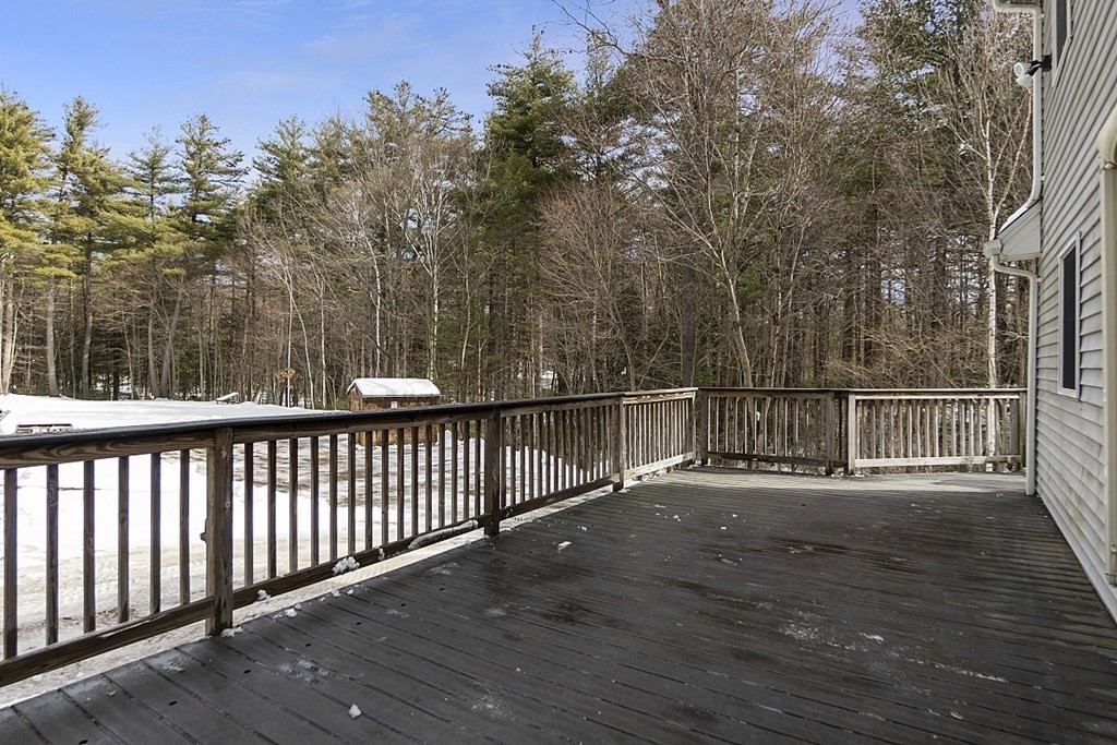 864 Foster Road Ashby, MA 01431 - Photo 30 of 41 a view of a balcony with wooden fence