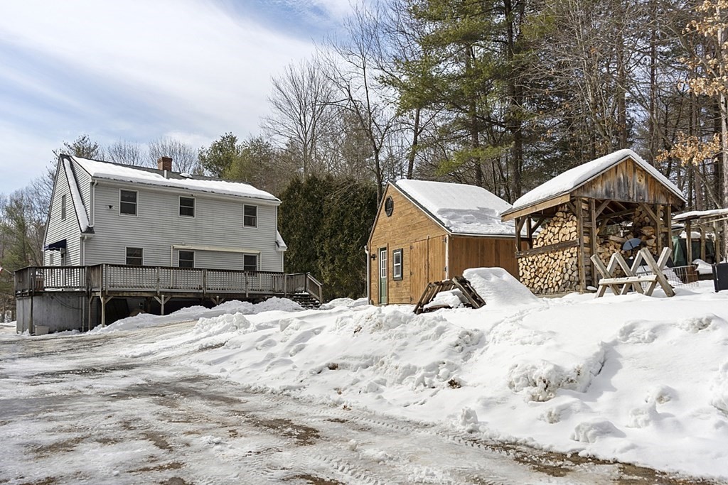 864 Foster Road Ashby, MA 01431 - Photo 35 of 41 a view of a house with snow on the road