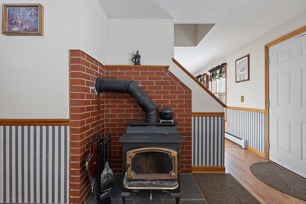 864 Foster Road Ashby, MA 01431 - Photo 5 of 41 a view of a livingroom with furniture and staircase