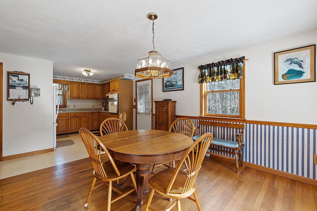 864 Foster Road Ashby, MA 01431 - Photo 7 of 41 a view of a dining room with furniture window and wooden floor