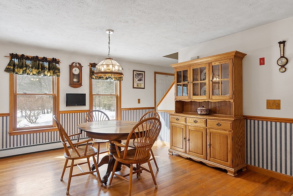 864 Foster Road Ashby, MA 01431 - Photo 9 of 41 a dining room with furniture window wooden floor