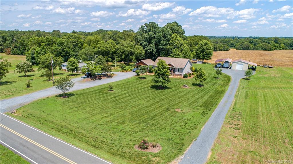 24376 Endy Road Albemarle, NC 28001 - Photo 2 of 27 a view of building and garden
