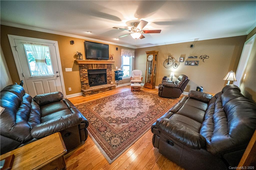 24376 Endy Road Albemarle, NC 28001 - Photo 11 of 27 a living room with furniture and a fireplace