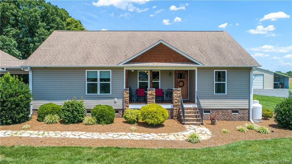24376 Endy Road Albemarle, NC 28001 - Photo 3 of 27 a front view of a house with garden
