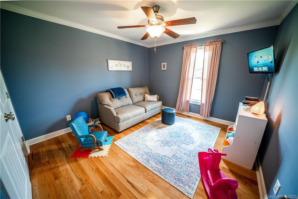 24376 Endy Road Albemarle, NC 28001 - Photo 22 of 27 a living room with furniture and a window