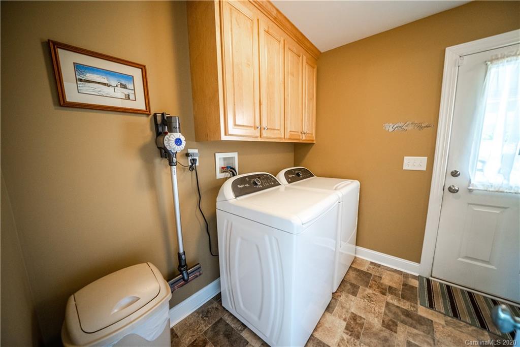 24376 Endy Road Albemarle, NC 28001 - Photo 25 of 27 a bathroom with sink toilet and window